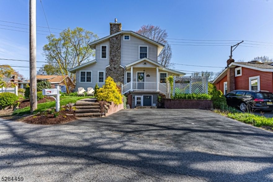 Charming Custom and Updated Colonial! Bright, Large Living Room with multiple windows and tons of natural light. Gorgeous Stone Fireplace with Wide Hearth is the focal point of this stunning open floor plan. Beautiful hardwood flooring. Lovely Architectural Features throughout, Give this Home a Lake Cottage Feel! Stunning kitchen with center island, two toned cabinets, granite countertops and stainless steel appliances. Cozy dining room, office area and convenient powder room complete this floor. Upstairs, a primary bedroom offers built-in window seat, walk-in closet. 2nd bedroom provides seasonal lake views. Neutral, ceramic tiled bathroom. Pull down steps to attic, generous 2nd floor hallway. Walkout, finished basement, with 2nd full bath is a real bonus! 2 driveways provide parking for 4. Plus, private patio spaces & fenced yard for outdoor enjoyment. Fantastic location; walking distance to Indian Lake Bistro, beaches, swimming, boating, playground & fun! Mins from DWTN, NYC commuter locations for both bus & trains. Top Schools! Brand new water heater. House has been meticulously maintained.
