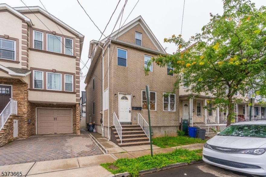 Welcome to this beautifully renovated two-family home, complete with a finished attic and basement! Each unit features updated kitchens and modern bathrooms, as well as central heating and air conditioning for year-round comfort. Whether you're an investor seeking strong rental potential or an owner-occupant looking for additional income, this property is an excellent opportunity. Ideally located just minutes from shopping centers, major highways, NYC, and public transportation this home offers both convenience and value.