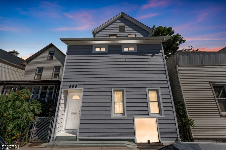 Welcome to this beautifully renovated two-family home! The spacious second floor duplex apartment truly feels like a private single family residence. It features a luxurious primary bedroom with en-suite bath, a separate dining room, generous living room, stylish kitchen, and a full guest bathroom, plus direct access to the backyard through the rear doors. Enjoy complete privacy with central A/C and hot forced air.  The first floor unit offers 2 bedrooms and 1 full bath. Please note: the renovation will be fully completed prior to closing, including the kitchen counters and any remaining finishes. Thoughtfully updated to today's market tastes and ideally located near the train station, bus transportation, major highways, and more. Live in one unit and rent the other, this property is the perfect blend of modern design and investment potential! There is a backyard currently being cleaned and set up, come and check it out!