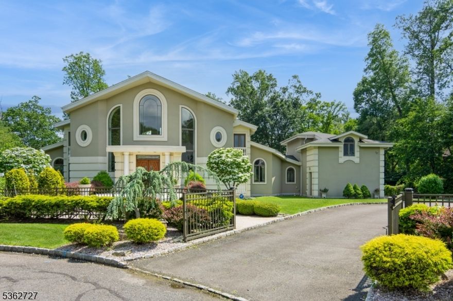 Discover a masterfully designed gated estate where innovation meets timeless elegance. Created by a renowned NYC architect and winner of the 2009 Builders Award, this architectural gem features ICF construction for superior efficiency and durability. Set on a private cul-de-sac with breathtaking views of Farrington Lake, the home evokes the serenity of Lake Como. Expansive Argon-filled glass windows flood the space with natural light, while teak doors and bamboo floors blend eco-conscious design with sophisticated style.The designer kitchen showcases imported Scavolini cabinetry and top-tier Wolf and Miele appliances. The open layout, free of corridors, enhances flow and grandeur throughout. The main level includes a luxurious suite with lake views, a marble fireplace, and spa-like bath, plus an additional bedroom/office. Upstairs offers another grand suite and two bedrooms. Outdoor highlights include an expansive terrace with a bronze fountain and stately colonnade. With a full unfinished basement, three-car garage, and opportunity for separate apartment above, this home is a rare blend of architectural brilliance, waterfront tranquility, and modern luxury within an hour from NYC.