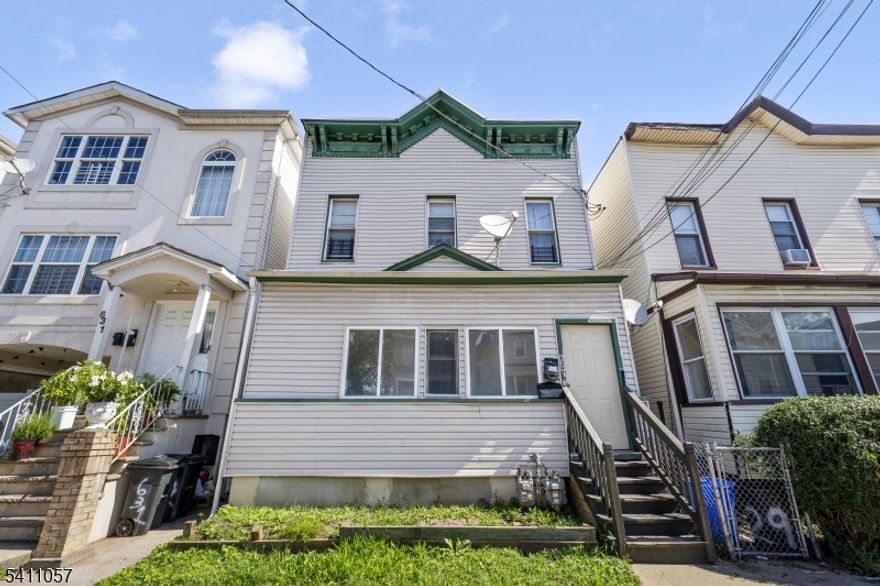 Don't miss this fully renovated two-family home in the heart of Elizabeth. This is an exceptional opportunity for investors and owner-occupants alike! Updated in 2025, each unit offers two bedrooms, a spacious living area, an eat-in kitchen, and a beautifully designed full bathroom. Both units feature luxury vinyl plank flooring, dark cabinetry with quartz countertops, herringbone tile backsplashes, stainless steel gas ranges, and refrigerators. The spa-inspired bathrooms impress with floor-to-ceiling gray tile, black-framed glass shower enclosures, rain head fixtures, and gold-accented mirrors. Each unit operates independently with separate gas heating systems, recessed lighting, and black ceiling fans throughout. On-street parking available. Conveniently sandwiched between Rt 9 and the NJ Turnpike, and a half mile from public bus transportation, this turnkey, move-in ready property is a rare find in a great location.