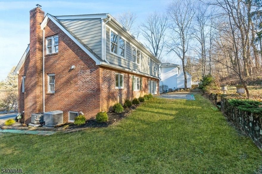 Welcome to this FULLY RENOVATED 5 bedrooms 3 1/2 bath custom home in the heart of Chatham. This home sits on 0.63 acres with extensive woods for privacy. The spacious living and dining areas flow effortlessly together, ideal for both entertaining and everyday living. The entrance level features a large living room with stained hardwood floors, a wood-burning fireplace with a wood mantel, a new kitchen in 2022, and a dining area that opens to a large family room with a gas fireplace and sliding glass doors to a new patio and private yard. The main floor also features 2 bedrooms and a full bath. The second floor includes a Primary Bedroom suite with two walk-in closets and a new bathroom, two additional bedrooms with ample closet space, and a full bath. The lower level has a large recreation room, laundry room, powder room, and utility room.  Two-car garage with garage door openers. This timeless home is located in Chatham's top-rated schools,  a commute to NYC, and a quaint downtown with lots of shopping and restaurants. Chimneys in "as is" condition with no known issues.