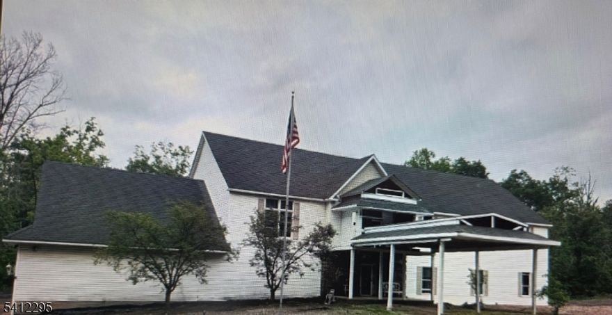 Opportunity Abounds! This is a one-of-a-kind property!  A Custom-Built 5-bedroom, 3.5-bath Colonial that includes, at your option, a two-story Aupaire, In-law, or Office suite with a private entrance and deck (14x14)! Quietly set back on a versatile 22-acre offering exceptional privacy, scale, and flexibility. This property offers a huge amount of space for any business or hobby imaginable!  A unique blend of comfortable living, seclusion, NO TRAFFIC on Old Highway 12!! Easy access and Ideal for car collectors, contractors, or owner-operators, the oversized garage accommodates 12+ vehicles, includes a car lift, and is equipped with three-phase electric, making it well-suited for workshop, fleet, or specialty storage. Ample on-site parking for 50+ vehicles makes the property adaptable for equipment storage, gatherings, or business use. Do you want horses, farm animals, or crops? Multiple options rarely found in one property! Open-concept living spaces (42' x 42'), a dramatic two-story foyer, and multiple decks (20x20 and 14x14) designed for entertaining and seamless indoor-outdoor living. Large bedrooms (16x16) and an exceptionally large master bedroom and bath (42x16). Minutes from the Delaware River, Frenchtown, Historic Flemington, Lambertville/New Hope, Phillipsburg/Easton! Less than 1.5 hrs from NYC and Philadelphia