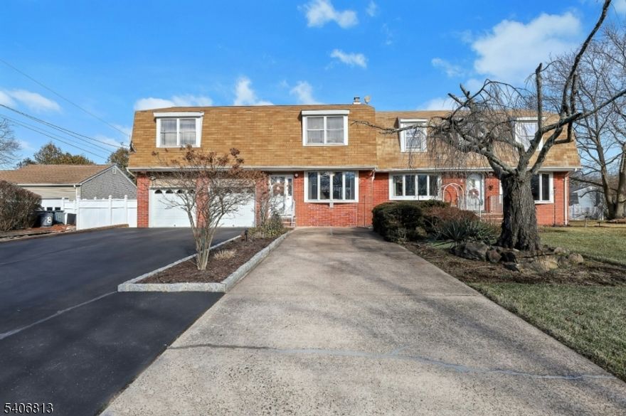 Welcome to this spacious and versatile 5-bedroom, 3 full bath Colonial set on a generous corner property entering a coveted cul-de-sac in Wayne. Designed for comfortable living with an oversized kitchen and dining area, this home offers a unique, custom floor plan. This center hall colonial features sun-filled living spaces, a well-proportioned kitchen with ample cabinetry, and seamless flow for everyday living and entertaining.  The sprawling living room has ample space for hosting social gatherings.  This beautiful home offers two main bedroom options. There is a large bedroom with two closets on one one side of the house and the other side of the home offers a bedroom suite including 2 private bedrooms, full bath, and living area?perfect for added privacy.  The second floor hosts 5 bedrooms in total and 2 full bathrooms to ensure convenience for all. Outside, the level yard offers plenty of space for outdoor enjoyment , gatherings and gardening.  With its classic Colonial charm, sprawling layout, and primary suite flexibility, this property presents a rare opportunity to meet today?s lifestyle needs in a timeless home.
