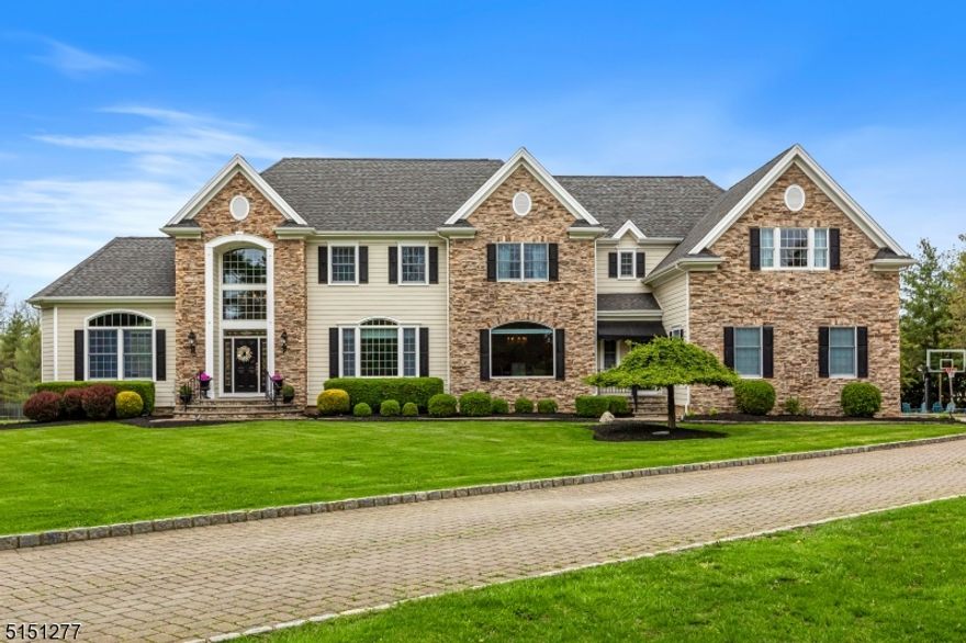 This remarkable center hall colonial sits on three beautifully landscaped acres, where the outside space is just as spectacular as the inside.  In the last three and half years the house has been updated in all the right places: the interior has been painted, carpets have been replaced, the HVAC and hot water heaters have been updated. The kitchen appliances have been replaced, the center island has a new granite countertop and a fresh coat of paint.  The sophisticated foyer leads to a sunken living room, a sunroom/library, a family room boasting a custom ceiling and wet bar. The large kitchen is perfect for entertaining. Beyond the kitchen is a mudroom, an office/bedroom and a full bath. The primary bedroom features a gas fireplace, two walk-in closets and a large master bath w/a soaking tub and a shower. The large basement provides additional recreational space as well as plenty of storage. The highlight of the resort like backyard is a blue stone terrace that overlooks a heated saltwater pool (with all new mechanicals). In addition to the terrace and the pool, the professionally landscaped yard features a basketball court and a firepit.  Couple this with the top-rated Bernards Township School District and a location convenient to the city, the mountains and the beach and you have an opportunity that is second to none!