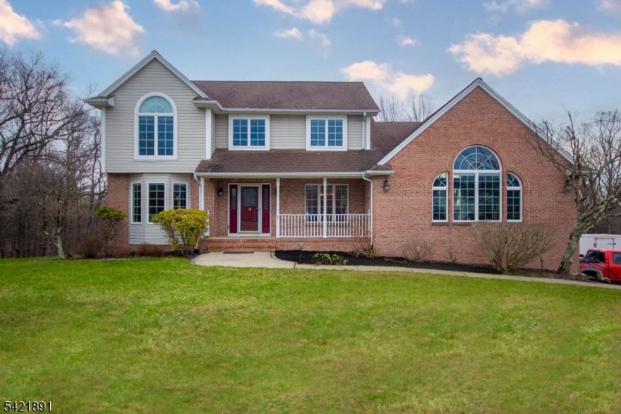 Peace and serenity surround you in this spectacular custom-built Colonial with an in-law suite on 4.40 acres backed up to wooded land preservation and lake views nestled in a cul-de-sac. The sunset views help to enhance the elegant lifestyle offered by this unique home. You'll be totally impressed the minute you walk thru the front door into a two-story foyer. Design features start with this impressive Great Room with cathedral ceiling, new vinyl plank flooring accented with skylights and recessed lighting, and sliders leading out to the deck, gourmet kitchen with lots of counter and cabinet space, new granite counter tops, stainless steel appliances, butler and work area, breakfast bar, tile flooring, sliders leading out to an oversized Trex type deck overlooking the pool and backyard.  Formal Living, Dining, and FR with wood burning FP, 1st floor laundry. Master bedroom features a vaulted ceiling, 2 closets, master bath with double vanity, soaking tub, stall shower, 3 more impressive size bedrooms all with brand new carpet, and another full bath.  Lower level features a separate entrance, a full bath with steam shower, living/dining room area perfect for an in-law suite. Efficient Geo-Thermal Heat and Central Air. For the discriminating purchaser who can appreciate exquisite detailing and design, this home is worlds apart from other homes available in the marketplace.  No other property more adequately describes the phrase, "When only the best will do"
