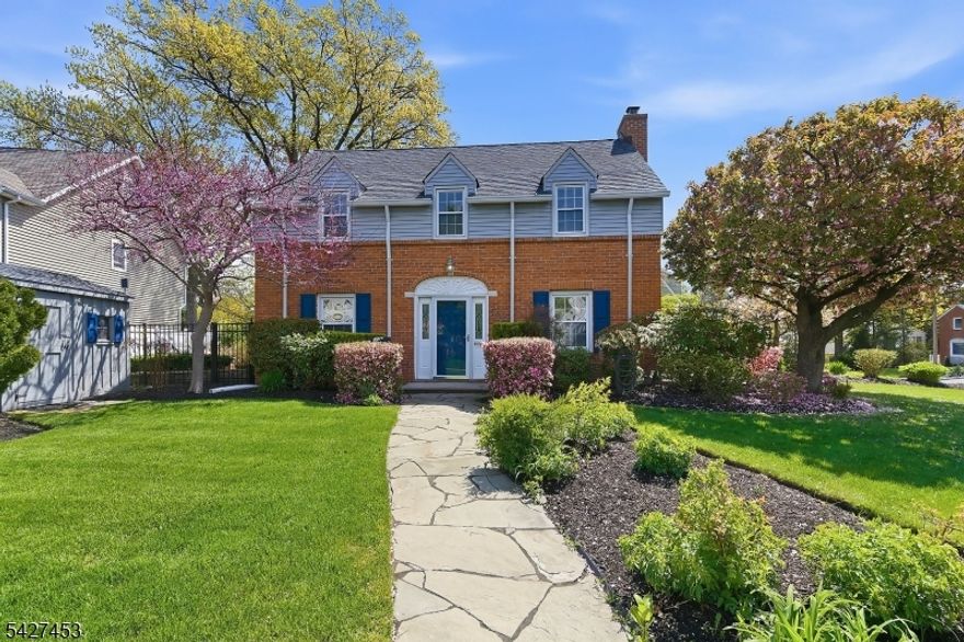 Stately and elegant brick Colonial home in one of central Bergen County's most idyllic neighborhoods! Tucked away in the immensely charming "Knolls" area, yet just steps to express NYC trans, this beautiful home was completely rebuilt in 2007 with the utmost care and quality. The inviting interior welcomes you in with a formal entry foyer flanked by archways leading to a spacious front to back living room w/fireplace and built-in bookcases and a separate formal dining room. Off the DR you will find the gorgeous kitchen with high end appliances, including a built-in fridge & double wall ovens, and honed granite counters. The sun-filled breakfast rm off the kit opens to an impressive family room with vaulted ceilings and a full bathroom (easily converted to first flr BR suite). Three spacious BRsw/custom closets and a full bathroom are on second floor. Fully finished basement offers great add'l living pace & tons of storage. Access to the fully fenced courtyard gardens with bluestone patios & perennial plantings can found off of the breakfast rm, LR and fam room. Gleaming hardwood floors throughout, cent air (2025), whole house generator, in-ground sprinklers, 200 AMP elec and much more.  Fantastic location in this tree lined private neighborhood is steps to express NYC transportation, close to local shopping and dining and easily accessible to all major highways. With its perfect blend of classic architecture, timeless design and modern updates, this home is not to be missed!