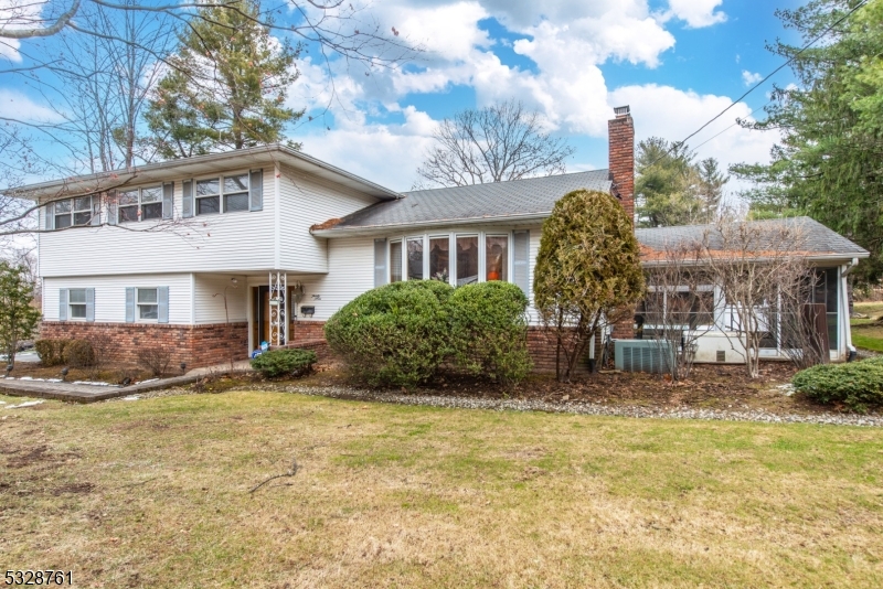 Picture a fabulous four bedroom, 2.5 bath expanded split level home nestled on apx 3/4 of an acre of picturesque, park-like property with a babbling brook and an inground pool, a paver patio and a cabana in your own backyard! This well maintained home boasts a 21'x 18' expanded family room with a vaulted ceiling with access to the expansive, fenced property with a resort style yard. Other features of this home include: hardwood floors,updated Pella windows and door, 2 fireplaces ( 1 wood burning in Living Room,1 Gas in Family Room), a whole house natural gas Generac generator, central air, a no step  2 car garage, newer gas HWH and furnace (2020-2021) and  a screened porch for summer entertaining and dining al-fresco. Great location, close to downtown Caldwell, schools and houses of worship. Make this your poolside paradise for the summer of 2025! Opportunity knocks...