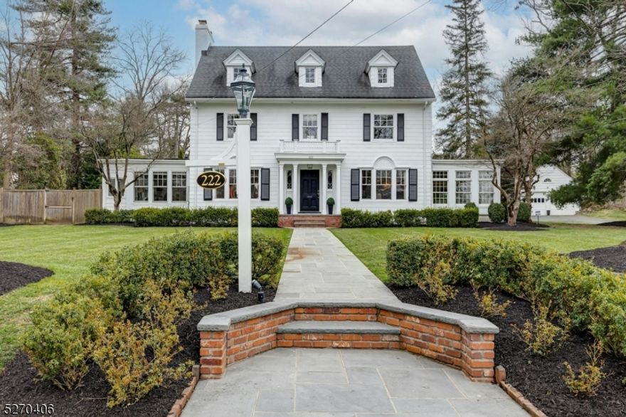 Spectacular Classic 6 Bedroom, 4.2 Bath Center Hall Colonial located in one of Westfield's most sought after neighborhoods, set on ONE ACRE of incredible property with expansive bluestone patios, surrounded by mature landscaping, just blocks from town, Franklin and Roosevelt Schools!  This stately & gracious home, circa 1922, is distinguished in every aspect - Impeccably maintained, boasting high ceilings, gleaming oak flooring, exquisite architectural detail & grand living & entertaining space.  The exceptional first floor is highlighted by the elegant Reception Hall, expansive Living Room with woodburning fireplace, banquet sized Dining Room, glorious Sun Room, Butler's Pantry with wet bar and wine refrigerator, and Custom Kitchen with center island, flowing to the large Family Room with woodburning fireplace flanked by handsome built-ins, & access to backyard oasis! The grand staircase sets the stage for the 2nd & 3rd floors!  The lower level boasts a versatile rec room for entertainment, powder room, laundry room, wine cellar & storage/utilities.  Private guest/au pair suite on 1st floor. Truly a special home, this "GEM" is move-in ready, in fabulous walk-to-everything location!  Click on MEDIA for floorplans and video.