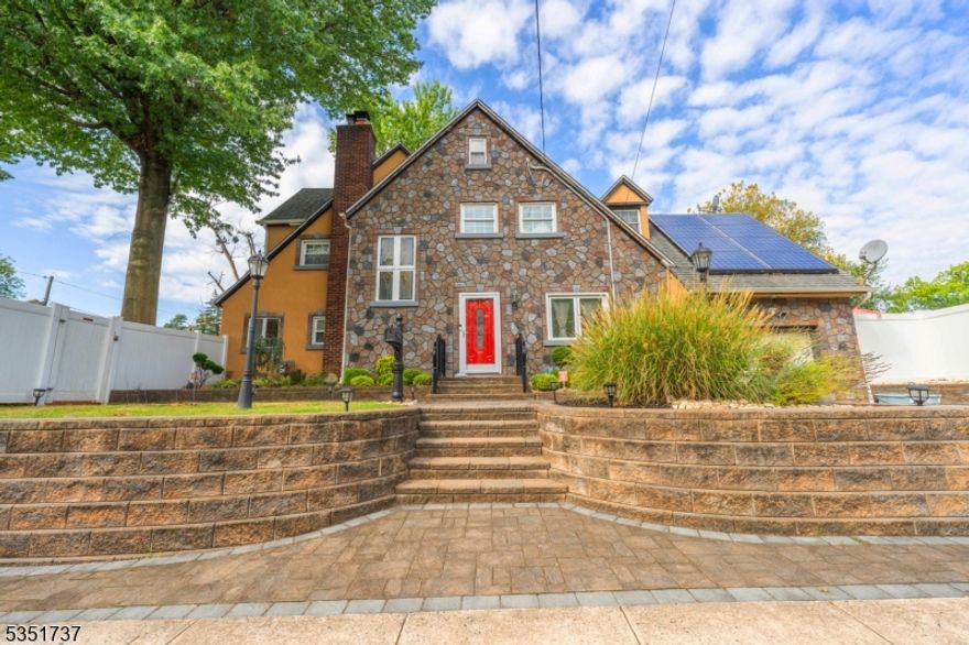 Welcome to a stunning Tudor Colonial that blends timeless character with exceptional indoor-outdoor living. This unique property offers a true outdoor oasis, featuring two expansive side yards designed for both relaxation and entertaining. One side showcases an in-ground pool complete with a bar area, creating the perfect summer retreat, while the other offers a custom outdoor stone grill and patio ideal for hosting gatherings or enjoying quiet evenings at home.Inside, the main level welcomes you with a gracious foyer leading into a spacious living room with a fireplace, a formal dining room, and a generously sized kitchen. A den conveniently located just off the living room adds flexible living space perfect for a home office, sitting area, or playroom. The home is equipped with central air conditioning and heating, ensuring year-round comfort. The upper levels offer an ideal layout for both comfort and privacy. The second floor features a guest bedroom with a full bath, while the third floor includes three additional bedrooms and two full baths, highlighted by a primary suite with its own en-suite bath. An additional finished level adds even more versatile living space. The fully finished basement further enhances the home with a full bath, two additional rooms perfect for office or guest use, and a dedicated laundry area. Completing the property is an attached garage along with two additional parking spaces. A truly must see!