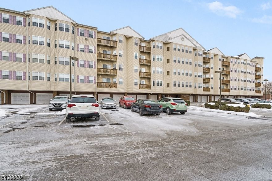 Welcome to this beautifully maintained top-floor, 2-bedroom, 2 full bath condo located in a desirable 55+ community offering comfort, convenience, and low-maintenance living. This bright and spacious unit features 10' ceilings, an open-concept layout, and beautiful views enjoyed from both the living area and private balcony. The large kitchen offers a granite breakfast bar that opens seamlessly to the living space perfect for everyday living and entertaining. The large primary bedroom is filled with natural light and includes a walk-in closet and an en-suite bath with double sinks. The second bedroom features a generous double closet, ideal for guests or a home office. Additional highlights include in-unit washer, dryer, HVAC, and hot water heater for easy access, a storage room off the laundry area, a coat closet, and custom molding in the foyer and bathroom. This elevator building offers wide common hallways with sitting areas and exceptional amenities, including an event room, library, fitness center, and billiards room. Enjoy the convenience of a one-car garage with interior building access, plenty of resident and guest parking, low taxes, and easy access to major highways. A wonderful opportunity to enjoy carefree living in a well-appointed community.