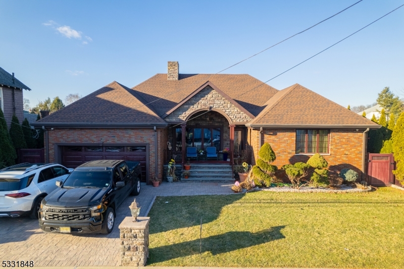 ONE OF A KIND CUSTOM HOME RENOVATED WITH TOP OF THE LINE IMPORTED MATERIALS, EAT-IN KITCHEN, 4 GOOD SIZE BEDROOMS, HARDWOOD FLOORS, 2.1 FULL BATHS,ONE WITH MASTER. 2  LGE. CAR GARAGES WITH  PARKING FOR 3 VEHICLES, DRIVEWAY WITH PAVERS, SITUATED ON A 75 X 110 LOT. 3000SF of living space, CLOSE TO PUBLIC,TRANSPORTATION, PARK, SHOPPING,