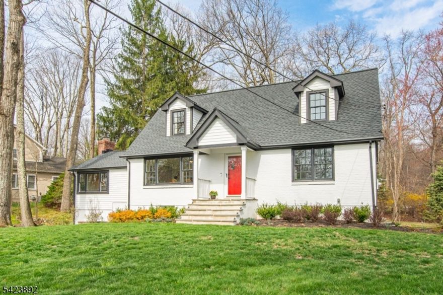 Nestled on a picturesque, level 0.60-acre lot in the heart of town, this custom Cape Cod home has charm, character & thoughtful updates. Tucked away w/ a driveway off Laurel Hill Rd, this gem offers serenity while being just steps from all that Mountain Lakes has to offer. Step into the stunning FR, where a soaring ceiling, oversized windows & a striking brick fireplace create a warm & inviting space filled w/ natural light. The newly renovated EIK is a chef's dream, featuring quartzite countertops, high-end SS appliances, custom cabinetry & a breakfast bar that flows into the formal DR, that  overlooks the rolling yard & opens to the FR. Outside, the deck invites you to dine and enjoy the peaceful surroundings w/ a stream & bucolic views. The 1st level also has 2 bright & airy bdrms and a crisp hall bath. The 2nd fl has 2 more bdrms & hall bath providing ample space for guests. The LL offers flexible living options w/ a finished rec room, gym, or home office w/ a private entrance, plus a laundry rm & plenty of storage. A brand-new high-efficiency heating system, along with recently updated composite siding, windows, and roof, ensures worry-free living. The detached 2-car garage & ample parking add to the home's convenience. Set in an unbeatable location across from Island Beach, where lake activities await, and with easy access to the Blvd Path, this home offers the best of ML living. Move right in & start enjoying this enchanting property and all the community has to offer.