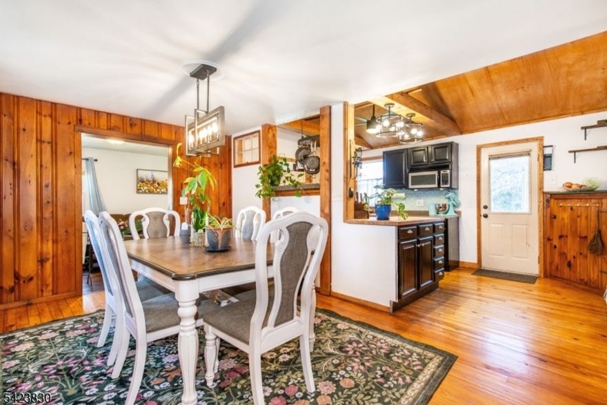 Discover a unique and versatile home in the desirable Pinecliff Lake community of West Milford! Conveniently located just off Union Valley Rd, close to shopping, dining, and Pinecliff Lake, with optional lake membership available. This property offers two distinct living spaces, ideal for flexible use. The main level features a lakehouse-style design with two bedrooms, a den/office, a library (both with potential for additional use), two full bathrooms, kitchen, dining room, and living room. The upper level offers a separate, modern-style living area with two bedrooms, one full bathroom, kitchen, dining area, and living room. Outside, you have a patio and deck for entertaining and a large driveway and yard to accompany your home. With four bedrooms plus two additional adaptable rooms and three full bathrooms, this home provides a variety of living possibilities. A rare opportunity in a sought-after lake community; this one needs to be seen so don't wait!