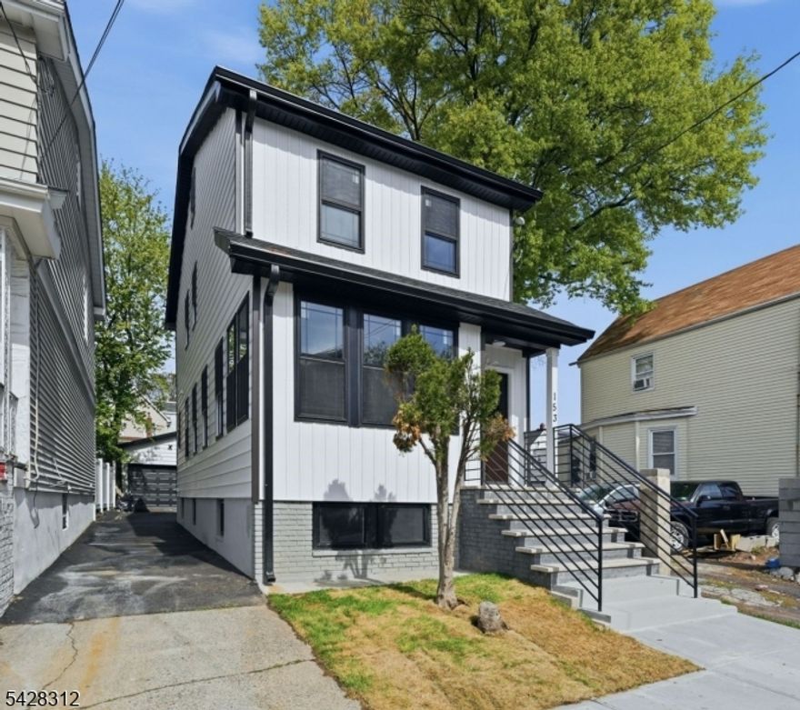 Stunning top notch modern single-family home offering 4 spacious bedrooms and 2.1 bathrooms, plus a finished attic and a fully finished basement. The first floor features a bright formal living room, an elegant dining area and a Beautifully designed kitchen featuring a center island with a built-in microwave space conveniently tucked underneath. sleek finishes and brand-new stainless steel appliances, along with direct access to a rear cozy deck.  A convenient powder room and an enclosed front porch provide ideal space for a home office, sitting area, or flexible use. The second floor along with the finished attic offers four generously sized bedrooms and a full bathroom, providing comfort and versatility. The finished basement showcases an open-concept layout, a full bathroom and a dedicated laundry area. This home is equipped with dual-zone central air and HVAC systems for efficient year-round comfort. The exterior features a private driveway, an oversized detached garage and a cozy deck ideal for entertaining and outdoor gatherings. Truly turn-key and move-in ready, conveniently located near NYC transportation, schools, shopping and more. A must-see home that offers the perfect blend of style, space, and functionality!