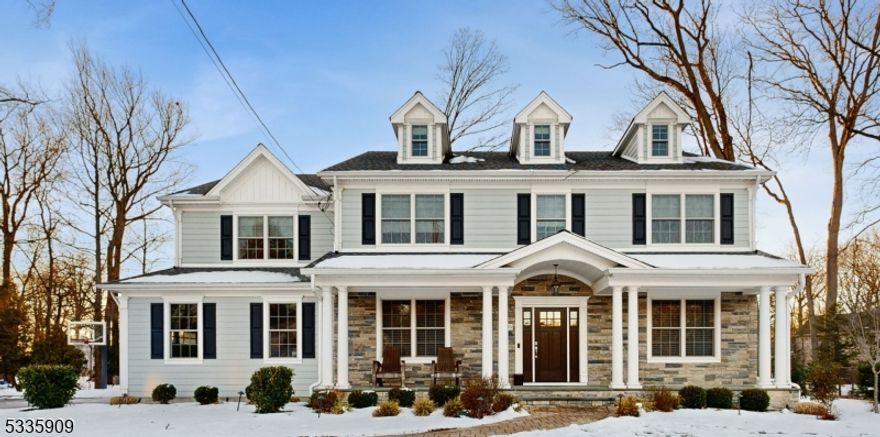 This stunning 6 bedroom, 6.5 bath Colonial is nestled on a quiet cul-de-sac in one of Westfield's most coveted neighborhoods. Offering over 6,000 sq ft (incl basement) of beautifully designed space, this home features high ceilings, hardwood floors, custom millwork, & modern amenities.The main level showcases an open concept layout w/ living room, formal dining room, gourmet chef's kitchen w/ a large center island, Jennair appliances & sunny breakfast nook which flows into the spacious family room w/ cozy fireplace & a beautifully crafted, custom-built wine room offering a unique space for tastings & storage and entertaining. Garage access, mudroom, powder room, & en suite guest bedroom complete the 1st floor. Upstairs, the primary bedroom is a peaceful retreat w/ cathedral ceiling, a spa-like bath w/ soaking tub & walk-in shower, walk-in closet, & separate dressing area w/ custom-built closets. 3 additional bedrooms, 2 full baths, & laundry room complete the 2nd floor  The 3rd floor offers an en suite bedroom providing comfort & privacy. The finished basement features a professionally installed home theater, full bath, & large recreation space. Outside, a charming covered front porch invites you to relax & unwind, while the paver patio in the backyard is perfect for outdoor entertaining. Extras incl: Generac generator, BBQ gas line, irrigation system & more. Located near Tamaques Park, top-rated schools, downtown Westfield, and NYC transport, this home truly has it all!