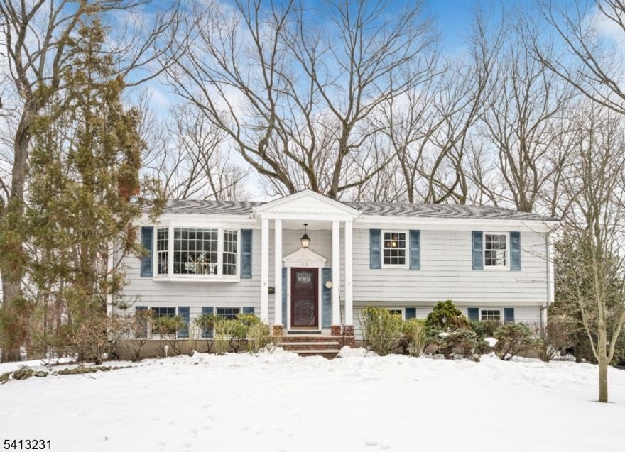 Beautiful, lovingly maintained, move-in condition family home located in a highly desirable section of Washington Township on a quiet cul-de-sac. This oversized property offers a peaceful setting with a walking path to a highly rated elementary school. The main level features an inviting entry foyer, a bright living and dining room combination, and updated eat-in kitchen with sliding glass doors leading to a spacious deck   ideal for entertaining or enjoying morning coffee. The primary bedroom includes a private half bath, along with two additional bedrooms and a full hall bathroom. Hardwood floors run throughout. The ground level provides additional living space with a cozy wood-burning fireplace, a laundry room with toilet and portable shower (convertible to a full bath), and access to a large private backyard   perfect for gatherings or relaxation. Additional highlights include a long driveway, a two-car garage, and proximity to parks, shopping, and major highways including the Garden State Parkway. A fantastic opportunity for buyers looking to settle in a great neighborhood and create their forever home.