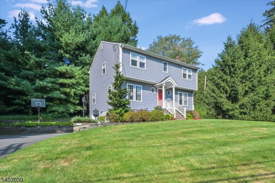 Welcome to this exceptional 4-bedroom, 2.5-bath Colonial that epitomizes turnkey living with an impressive list of thoughtful improvements throughout. The entry foyer welcomes you home leading to a beautiful kitchen that features granite countertops, hickory cabinetry, stainless steel appliances, and a center island that opens to a lovely breakfast room perfect for casual meals. Just off the kitchen is a charming covered porch overlooking the private yard and a 2-tiered paver patio that is the ideal space for grilling, relaxing or entertaining this spring! Back inside, the formal dining room flows to a large family room - spacious and comfortable with abundant natural light, hardwood flooring, and highlighted by a woodburning fireplace. A perfectly placed powder room completes the 1st level of this pristine home. Gleaming hardwood floors continue upstairs to 4 generously sized bedrooms, including a primary with a private en-suite bath and enormous walk-in closet. The three additional well-appointed bedrooms all offer ample closet space and easy access to the updated hall bath. The finished lower level has a terrific rec room, bright laundry room, extra storage and interior access to the spacious attached garage and an extended driveway for plenty of parking. This meticulously cared for home has too many updates to list! Move in and be a part of all Glen Rock has to offer!