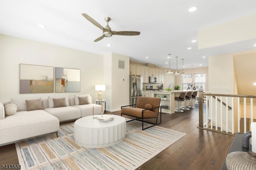 Best Value in Livingston & Low Monthly HOA Fees. Stunning 4 Year Old Townhome, approx. 2000 sq ft of Modern living in the sought-after Livingston Square community. Built in 2021, this home features a flexible floor plan with numerous upgrades, ideal for today's changing lifestyles. The main level showcases an open-concept living, dining, and kitchen area bathed in natural light via oversize windows, upgraded wood floors, a built-in office nook, and a private deck. The gourmet center island kitchen boasts quartz countertops, stainless steel appliances, and a large double pantry. Upstairs are three spacious bedrooms and two full baths, including a luxurious primary suite with two walk-in closets and a tray ceiling. The laundry is conveniently located on the bedroom level. The ground level includes a sunlit office/den (potential 4th bedroom) and access to a 2-car garage with epoxy floors and Tesla charger. Other features include ceiling fans in every room, water softener, reverse osmosis filter, and Container Store closet systems in the 2nd, 3rd bedrooms. The home overlooks a beautifully landscaped green space (largest in the community) with a gazebo. Conveniently located close to train and bus with service to NYC, and within walking distance to Livingston Mall and the express shuttle to S. Orange train station. Close to world-class shopping at Mall at Short Hills, dining, parks/recreation, and top schools. Great opportunity for investors or quick move-in!