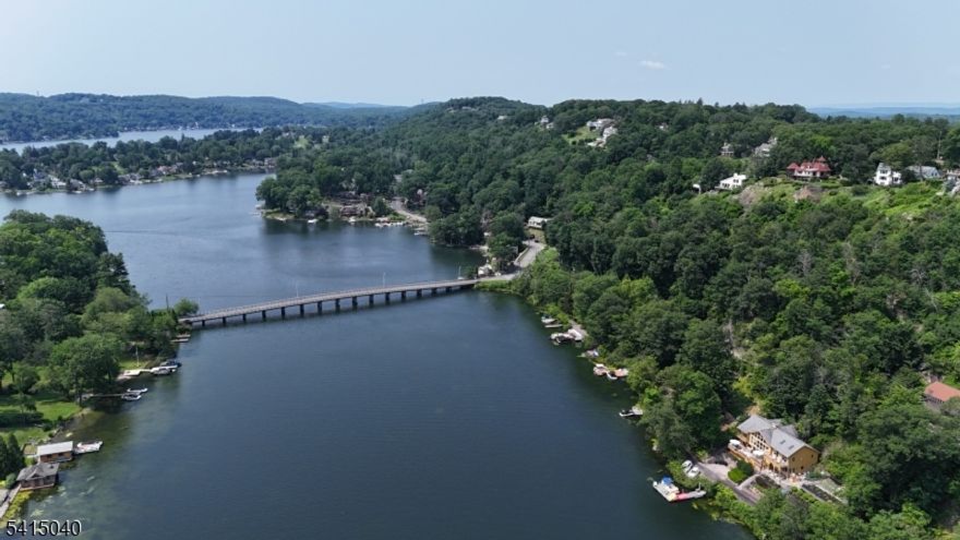 LAKE MOHAWK - MEMBERSHIP LOT. Membership provides access to a vibrant lake community featuring multiple private beaches, boating, fishing, waterfront dining, and a full calendar of social events. Residents enjoy year-round recreation, from summer days on the lake to seasonal activities that make this community truly special! This is a non-buildable plot of land that provides access to Lake Mohawk Country Club.