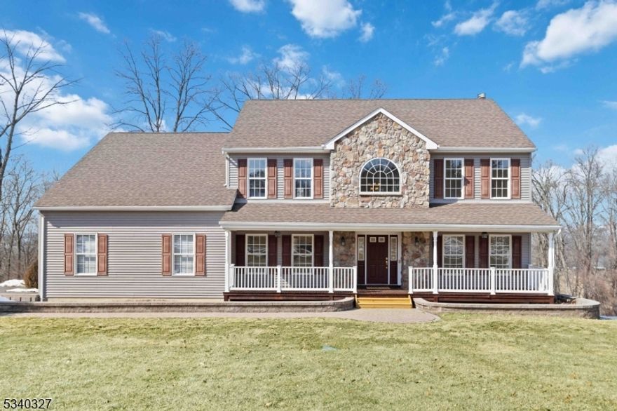 Welcome to this elegant 2003 Colonial nestled in the sought-after Meadow Ridge Estates! This spacious 4-bedroom, 3-bathroom home offers a versatile main-level bonus room, perfect for a home office or guest suite. Step into a grand two-story foyer, flanked by a formal living and dining room, leading to a beautiful eat-in kitchen with granite countertops, a breakfast bar, and seamless flow into the expansive family room. Cozy up by the wood-burning fireplace or step through sliding doors onto the brand-new deck (2024) ideal for outdoor entertaining!  A full bathroom and convenient laundry room complete the main level. Upstairs, the primary suite is a true retreat, featuring a sitting area, two large closets with extra storage one of them a walk-in with extra storage, and a luxurious en-suite with a jetted tub, dual sinks, and stall shower. Three additional spacious bedrooms and a full bath with a tub round out the second floor. The walkout basement offers high ceilings and endless possibilities to create additional living space, a home gym, or a media room. Additional highlights include a 2-car oversized attached garage, central vacuum, underground sprinklers, and a paved patio. Nestled in a private and peaceful neighborhood, this home offers the perfect blend of comfort and convenience. Don't miss the opportunity to make it yours!