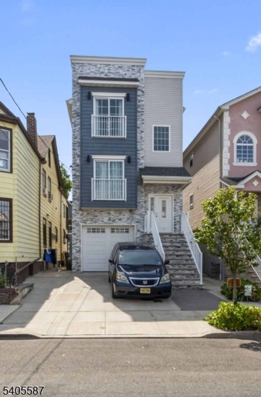 Great investment or Owner-occupied opportunity in the heart of Elizabeth! This newly constructed two-family home offers two separate units, each with spacious layouts and abundant natural light. The property features a solid structure, separate utilities, and ample living space, making it ideal for investors or home owners looking to offset their mortgage with rental income. Conveniently located near public transportation, major highways, shopping, schools, and local amenities, this property provides easy access to NYC and surrounding areas. Whether you're expanding your investment portfolio or searching for a home that has endless potential in a desirable neighborhood. Don't miss this opportunity to own a versatile two-family property in a prime location.