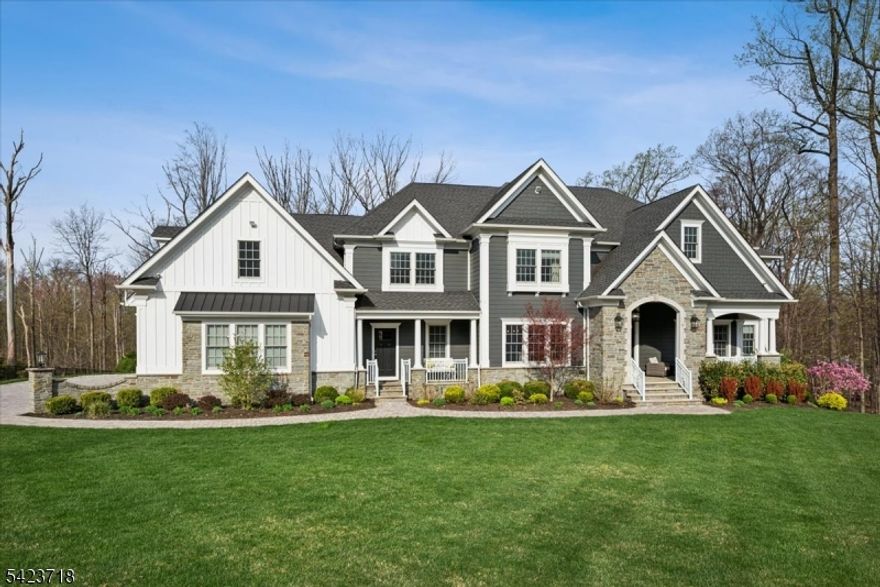 Set on 3 breathtaking acres, this exceptional "better-than-new  custom home offers a rare turnkey opportunity for the most discerning luxury buyer.Built by Warren's premier builders, this home exudes refined elegance, superior craftsmanship, and a level of privacy that is increasingly difficult to find. Acquired before completion, the current owners elevated every detail featuring bespoke flooring, designer moldings, a fully integrated, water-cooled whole-house generator, along with advanced high-profile security, interior/ exterior surveillance, exterior lighting, and leak detection systems.The heart of the home is the designer kitchen appointed with Sub-Zero, Wolf, and Fisher & Paykel appliances, complemented by premium quartz surfaces & impeccable finishes throughout. No expense spared in the professionally curated interiors, including custom furnishings, window & wall treatments. An exceptionally efficient & elegant floor plan offers a first-floor guest suite with a full bath, a private office with custom ceiling moldings, 2 staircases, & a beautifully designed mudroom. Expansive, high-ceilinged rooms provide an abundance of natural light & luxurious living space while multiple fireplaces enhance the home's warmth & ambiance including an additional fireplace in the recreation room. The primary suite serves as a true retreat, complete with a double-sided fireplace, custom walk-in closets, a sitting area, and a spa-inspired bath with an oversized shower &  soaking tub.
