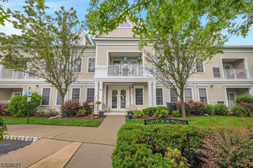 Welcome to this beautifully maintained 2nd-floor end unit in desirable Brookfield Glen 55+ community. This spacious 2-BR, 2-bathroom home includes versatile bonus room perfect for home office, den, or guest room. Enjoy serene, private farm views from windows and balcony, all within an elevator building offering convenience and accessibility. The open-concept layout features high ceilings, welcoming entry foyer, kitchen with abundance of cabinetry, island, newer appliances -refrigerator, microwave, dishwasher, range oven. Living and dining rooms feature durable flooring and plenty of natural light, ideal for both everyday living and entertaining. Primary suite includes oversized walk-in closet, dual vanity, walk-in shower. 2nd full bath features tub shower, linen closet. Carpeted 2nd BR and bonus room; dedicated laundry/utility room adds extra functionality. Updates include newer hot water heater (2016), washer, updated flooring in kitchen, BRs (2022). Other features include 2 reserved garage parking spaces, 2 private storage cages, ample interior closet space. HOA fee includes access to community's extensive amenities: clubhouse with pool, fitness center, shuffleboard, bocce courts, library, game rooms, walking trails, organized day trips/events. Building includes its own lobby, bathrooms, community gathering room. Move-in-ready opportunity to enjoy low-maintenance living in a vibrant, amenity-rich 55+ community with easy access to local shopping, restaurants, and more.