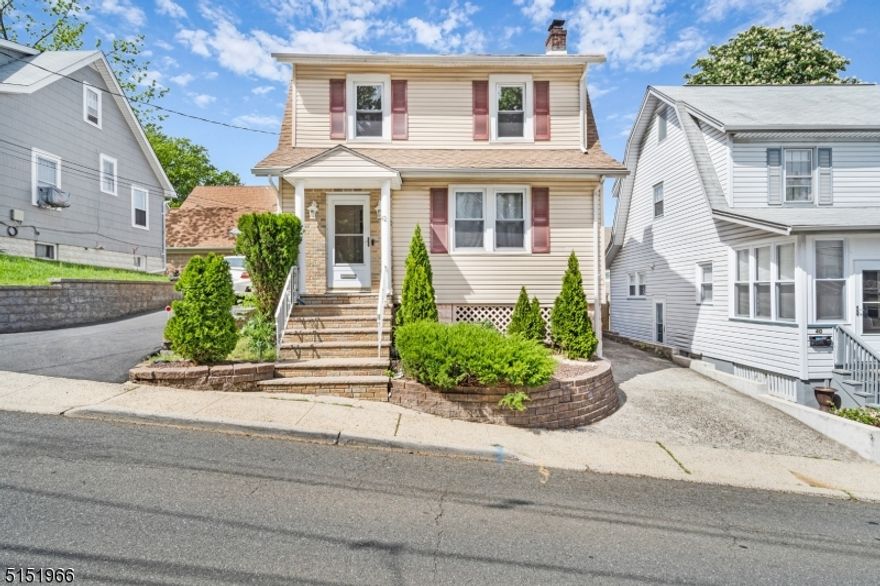 Charming 3 bed, 2 bath Colonial home centrally located to all your needs in the heart of West Orange. Perfect opportunity to customize a home w/ incredible value-add potential. Inviting front porch opens to spacious living room with wood burning fireplace which opens to the dining room. The Kitchen with all appliances included has a slider door to deck leading to yard. Yard is easy maintenance. 3 good size bedrooms and a full bathroom finish out the second floor. Walk up attic for storage.Basement has a full bathroom, laundry room, utilities, and storage.  There's room for an office or workout room or den!  Townhome alternative without the HOA Fees and very little maintenance of exterior! Low-maintenance lifestyle with easy accessibility to public transportation. Whether a train or a bus you are minutes away.  Don't miss out on this opportunity to make this home your own!