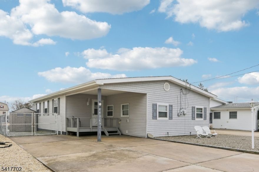 Welcome to Mystic Island, where peaceful waterfront living meets Jersey Shore convenience. This charming 3-bedroom home is just enough to enjoy with its spacious open floor plan filled with natural light let it by the sliders that lead to spacious deck overlooking the water views.  The bright and versatile layout creates a comfortable space for both everyday living and entertaining. Step outside to a large deck overlooking the water and enjoy 50 feet of bulkhead with room to dock your boat, kayaks, and water toys, offering convenient boating access to Great Bay and open water. Western water exposure provides beautiful evening light and seasonal sunset views, creating the perfect setting to relax by the water.  Designed for easy shore living, the property offers low-maintenance waterfront living. Ideally located just minutes from the beaches of Long Beach Island, the bay beach at the end of Radio Road, Tuckerton Seaport, local marinas, restaurants, and shopping, and approximately 30 minutes from Atlantic City. Perfect as a weekend shore getaway or year-round waterfront home.   Why rent when you can own, enjoy all year and build equity?!