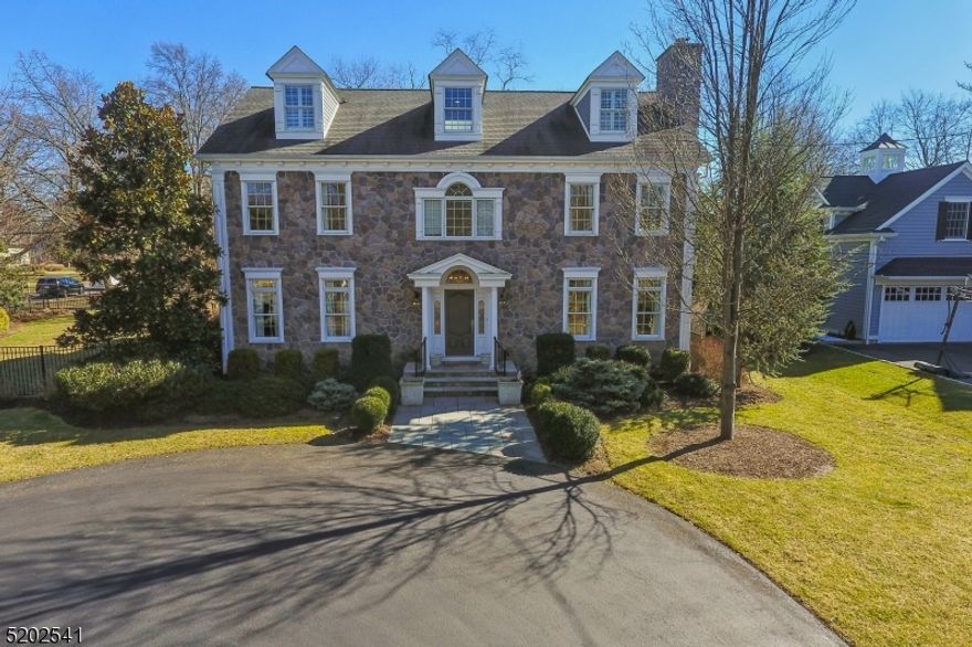 Elegance meets sophistication throughout this gorgeous center-hall colonial based in the heart of the Rolling Hill section of Chatham Township. You can't help but notice the craftsmanship of the custom staircases when you enter the home. Each detail shows pride of sole ownership throughout the four finished floors of over 7,000 square feet, thoughtfully laid out for living, working, and entertaining. Custom built in 2007 with updates and upgrades consistently, including a full new kitchen and bar with new appliances, light fixtures, marble and granite countertops, and new flooring in 2018. The entire exterior of the house was repainted in 2022. The light-filled kitchen is the heart of the home, opening to a family room. The first floor also has your formal living room, dining room, and office. The back staircase to the bunkhouse over the garage is just one example of the very smart layout of this exceptional home. Enjoy five spacious and light-filled bedrooms, plus two additional rooms that can be used as an office, den, or additional bedrooms, and five full and one-half bathrooms. The lower level is much more than a basement, complete with a full bar, gym, living and recreational rooms, full bathroom, and plenty of storage space. The two-car garage contains a wall storage system and sealed flooring, and bluestone front and side walkways. Recent upgrades include a fenced-in side yard and a seal-coated driveway. Come right home and enjoy the best of Chatham living.