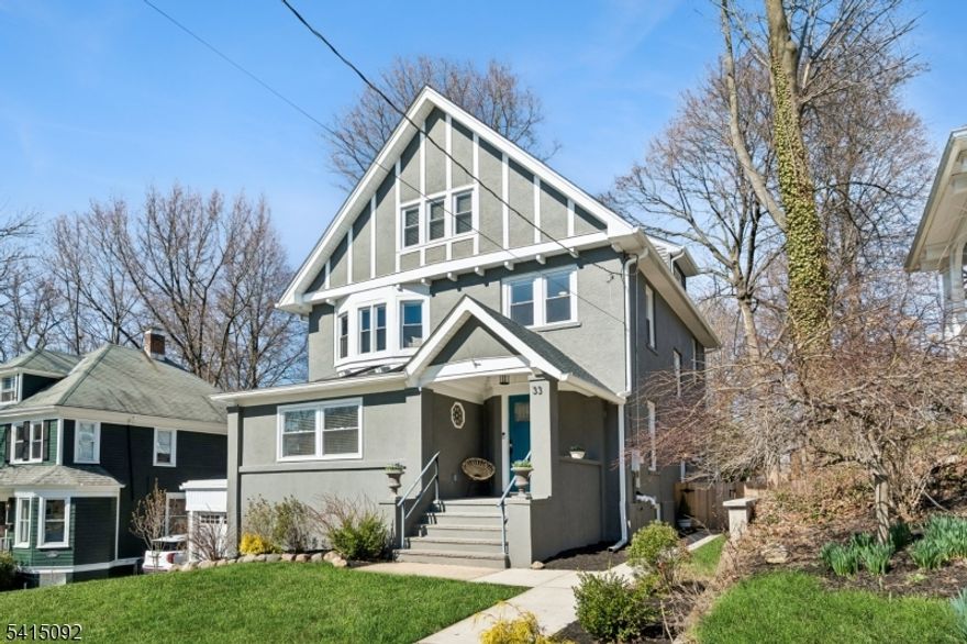 Incredible Maplewood dream home in a coveted location just steps from Village, trains and parks. Extensively renovated in 2024, this turn-key home offers nearly 4000 sq. ft. of living space across 4-levels with light-filled rooms arranged in a versatile, flowing floorplan. Enter into a dreamy, open-plan 1st floor which beautifully blends period details (beamed ceilings, wide moldings) with stunning modern finishes, including stylish lighting and wide-plank French oak flooring. The dream kitchen features high-end GE Cafe appliances, gas range with pot filler, quartz counters, tile backsplash, ceramic sink and full-height, soft-close cabinety. A breakfast bar with seating and serving bar with beverage fridge are nearby. Generous dining room and living room spaces, a sun-drenched family room, half bath and versatile sunroom overlooking the yard complete this level. Upstairs find bright bedrooms and 3 full baths, including the sophisticated primary with large walk-in closet and spacious bath with double vanity, soaking tub and glass-enclosed shower. The lower level is fully finished to offer leisure space, laundry room with sink and built-in cabinets and bonus full bath with shower and access to the garage. The fenced backyard features a composite deck overlooking a private, woodsy backyard. 2024 updates include a new roof and gutters, new thermal windows, new thermal side doors and custom built-in shelving. Smart home dimmers (1st flr), Nest thermostats and front door lock.