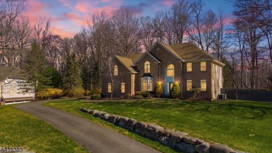 Beautifully maintained 5-bedroom, 3.5-bath Colonial in Sparta, ideally situated at the end of a quiet cul-de-sac in a pristine neighborhood just minutes from town. Filled with natural light, the first floor showcases exceptional architectural details, including oversized windows, hardwood floors, a sunken family room with vaulted ceiling, skylights, and a wood-burning fireplace, as well as a formal living room and dining room with inset hardwood accents and picture molding. A dramatic two-story foyer with dual coat closets creates a welcoming entry. The kitchen features stainless steel appliances, granite countertops, a built-in desk area, and pantry. A private office with French doors is conveniently located near the entrance and adjacent to the powder room. Upstairs, the spacious primary suite offers a sitting area, walk-in closet, vaulted ceiling, and a large en-suite bath with jetted tub and separate shower. Three additional generously sized bedrooms share a full bath and provide ample storage. The fully finished basement adds valuable living space with a recreation area, full wet bar, and a fifth bedroom with full bath ideal for guests. Enjoy outdoor living in the level backyard featuring a beautiful in-ground pool, deck, and patio perfect for summer entertaining. Complete with a large, bright two-car garage and outdoor storage shed, this home offers comfort, space, and a true retreat lifestyle. Vacation where you live! **4-bedroom septic. Square footage per tax records.