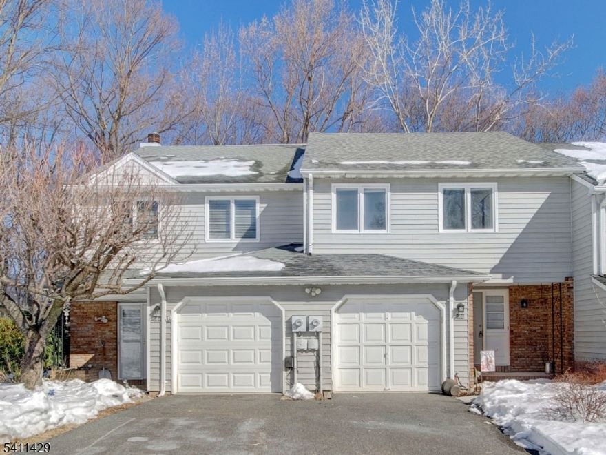 Welcome to this bright and spacious townhome nestled in the highly desirable Powder Mill community of Parsippany! Move-in ready, this beautifully maintained home offers an inviting layout and thoughtful updates throughout. The first level features a generous entry foyer, an updated kitchen with stainless steel appliances and an open-concept living and dining area designed for effortless everyday living and entertaining. Sliding doors lead to a private deck overlooking a lush, green backyard-- the perfect setting for relaxing or hosting guests. Upstairs, you'll find two generously sized bedrooms and a full main bath, offering comfortable and functional living space. The unfinished basement provides abundant storage and excellent potential for future finishing, along with a laundry area.  Residents of Powder Mill Village enjoy fantastic amenities including an outdoor swimming pool, clubhouse, and tennis courts. Conveniently located near major highways, shopping, dining, and all that Parsippany has to offer   including its highly regarded school system and desirable Morris Plains mailing address. Low monthly HOA fee! Don't miss this opportunity to own a wonderful home in a prime location. Schedule your private showing today and make it yours!