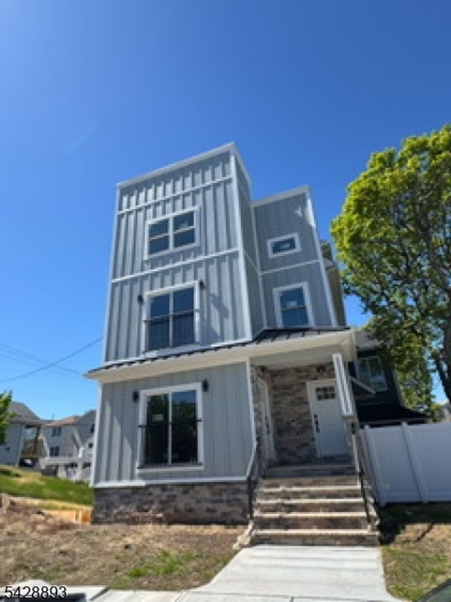 Totally Renovated Two Family With Finished Basement And Finished Attic. Corner Lot with lots of parking. Nice Backyard, Modern Kitchens and Bathroom. Hardwood Floors. Central Air. New Roof, New Siding. A must See!