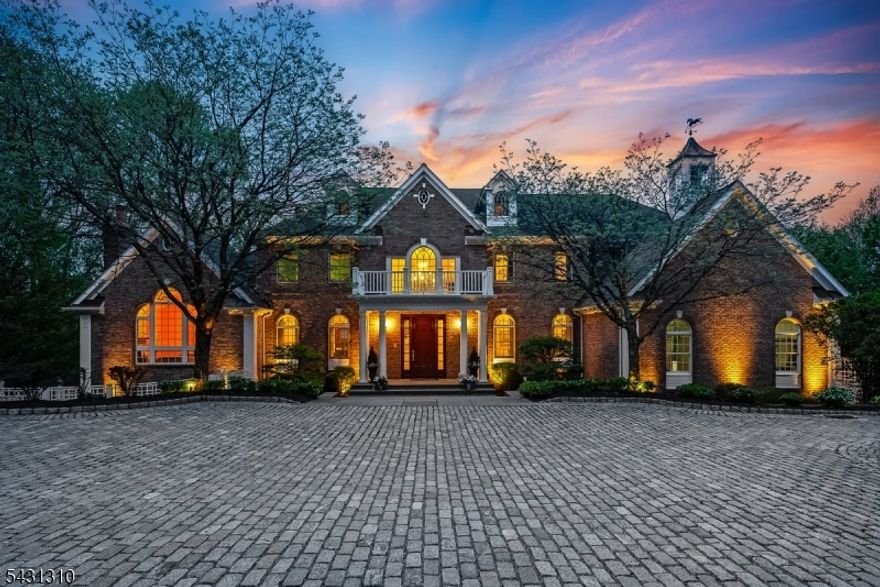 This refined residence, set on 4.21 acres in one of Chester's most coveted neighborhoods, provides sweeping views as far as the eye can see, creating a sense of awe, but also peace & warmth. The thoughtful layout supports both everyday living & entertaining w/ equal ease. A grand mahogany front door opens to interiors rich in architectural detail, including vaulted ceilings, custom molding & 5 fireplaces. The dramatic 2-story great room anchors the main living level, while the updated kitchen, equipped w/ high-end appliances, connects seamlessly to gathering spaces designed for both casual use & formal occasions. A private office w/ 2 sets of French doors, custom bookcases & FP provides an elegant & quiet workspace. Five bedrooms & 5.1 baths include a first-floor en suite bedroom & an exceptional primary suite on the second level, w/ a private sitting room featuring a FP & wet bar, a spacious bedroom, a spa-inspired bath & an expansive WIC. An additional en suite bedroom offers its own distinctive presence w/ an updated bath, large custom WIC & coordinated chandelier detailing. The finished lower level expands the living experience w/ a spacious recreation room, sitting room w/ FP, exercise room, home theater, full bath, & walkout access to a wide slate patio. Add'l outdoor spaces are equally compelling, highlighted by a beautiful Ipe deck overlooking the landscaped grounds & valley, an entrance fountain, a garden sitting area & a paver-lined driveway w/ generous parking.