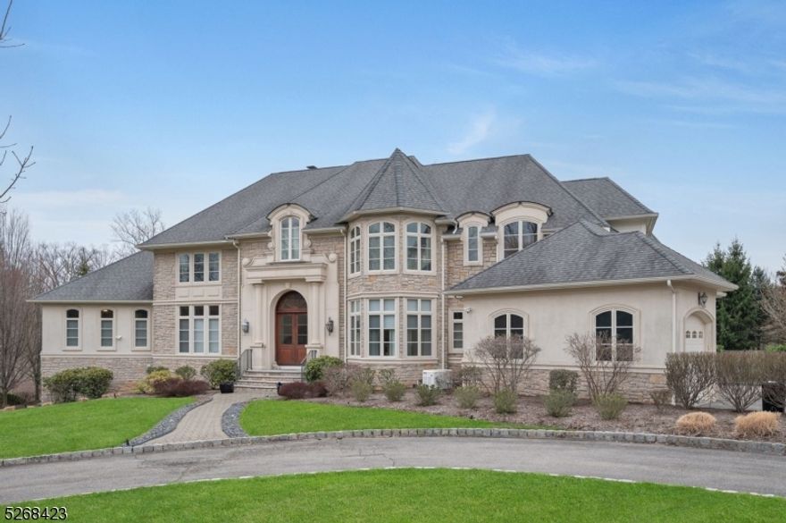 Nestled on nearly two-thirds of an acre of stunning property, this remarkable custom colonial boasts 8 bedrooms 5.2 bathrooms and sits on a private cul-de-sac, offering the epitome of luxury living with every conceivable amenity. This exceptional home spans 6,500 square feet of opulent living space, complemented by an additional 3,800 square feet in the walkout lower level, featuring a second gourmet kitchen, exercise room, rec room, and 2 bedrooms on the lower level. The designer white kitchen showcases furniture-quality cabinets, Calcutta Gold marble counters, and high-end stainless steel appliances, with a butler's pantry leading to the formal dining room. The master suite boasts a gas fireplace, two oversized walk-in closets, a laundry closet, a luxurious master bath, and a separate sitting room with 2 additional custom closets and French doors leading to a private deck. Pella Architect Series windows, a bluestone patio overlooking an expansive bi-level backyard, heated  salt water gunite pool and spa complete this private oasis. A bonus room on the third level lends itself nicely to additional offices pace or an oversized playroom. Close proximity to houses of worship, New York City transportation, highways, and airports make this home a true gem. Not to be missed!