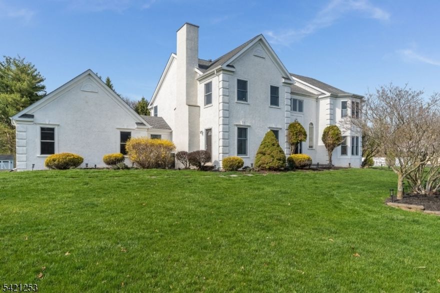 Thoughtfully updated and meticulously maintained, 4 BDRM, 2.5-bath colonial sits on nearly an acre with a tree-lined open backyard offering exceptional privacy. Major updates include a newer roof, Andersen windows and sliding doors, updated HVAC, kitchen, baths and flooring and so much more!The chef's kitchen, renovated in 2022, features custom cabinetry, quartz counters, a contrasting maple island with bar seating, stainless appliances with an exterior-venting hood, subway tile backsplash, and a dry bar with wine storage. The kitchen flows into the family room with a floor-to-ceiling stacked stone fireplace, a dining room with bay window and crown molding accents, and a large laundry/mudroom with garage and backyard access.Hardwood floors extend through most of the main level. A private den with built-in bookshelves and rear bay window, comfortable living room with front bay windows, and an updated powder room rounds out the first floor.Upstairs, new carpeting runs throughout the dramatic two-story foyer, all four bedrooms, and the hall. The primary suite offers a bay window sitting nook, tray ceiling, dual walk-in closets, and an updated en-suite with custom cabinetry and designer tile. Three additional bedrooms are spacious with lots of closet space and share an updated main bath.Partially finished basement with industrial-edge epoxy floors and painted walls offer endless opportunities. Conveniently located between NYC and Philly. SQ FT per Tax records.