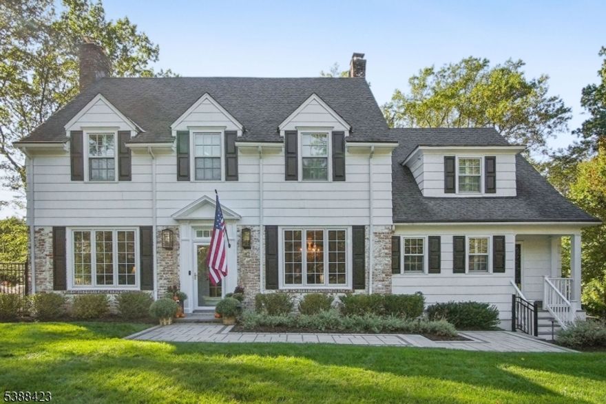 Nestled on one of Summit's most desirable Northside streets, this timeless Colonial residence masterfully blends classic elegance with modern luxury. Located within the top-rated Lincoln-Hubbard School District, the home offers a rare opportunity to enjoy refined suburban living in a truly exceptional setting. A gracious foyer welcomes you into beautifully appointed interiors that balance comfort and sophistication. The expansive Living Room and formal Dining Room are ideal for entertaining, while a sunlit Sitting Room provides a peaceful retreat. The heart of the home is the beautifully updated, bright Eat-In Kitchen outfitted with top-of-the-line appliances, 2 dishwashers, custom cabinetry, and premium finishes. Just off the kitchen, a spacious Family Room invites relaxed everyday living. The first floor also features a private Office. Upstairs, five generously sized bedrooms include three with en-suite baths. The large finished basement, complete with a sixth bedroom and full bath offers a spacious recreation area. The home offers laundry on both the 2nd floor and in the basement.  Step outside to the newly updated outdoor space featuing a heated pool, hot tub, and a state-of-the-art entertainment system and kitchen all surrounded by lush, professionally landscaped grounds. Blending traditional charm with modern amenities, this distinguished home offers an unparalleled lifestyle in one of Summit's most prestigious neighborhoods.