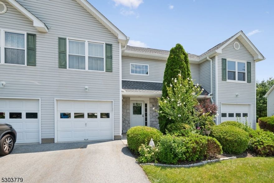 Serene Setting & Convenient Location!  Lovely 2-bedroom townhome in the coveted Walden Village community with 2 bedrooms, 1.5 baths, 1-car garage and many amenities in a peaceful neighborhood with easy access to everything you need. A gracious front entry and foyer welcome you inside to an airy 1,400+ sq ft unit with many updates, including New Roof. Past interior garage access and a half bath with in-unit laundry, the main floor opens to a kitchen renovated in 2018, with glazed cabinet topped with granite counters stainless steel appliances and peninsula with seating. There's direct flow into an open living and dining room with rich hardwood floors and a gas fireplace for chilly nights. Sliding glass doors lead out to a patio and lawn that are perfect for indoor/outdoor entertaining, sipping coffee or cocktails, or just relaxing in the sun. The second floor is host to an oversized primary retreat with a huge bedroom and 2 walk-in closets, a second generous bedroom and a full hall bath with stone-topped storage vanity, tub/shower combo, and handy direct access from the primary. This wonderful community offers residents a club house, in-ground pool and adjacent playground, tennis courts and more. Close proximity to downtown Hamburg with shopping, dining, golf and more.