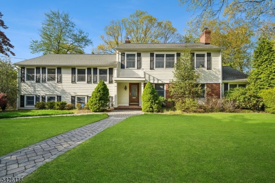 FABULOUS SHORT HILLS POETS SECTION HOME * MODERN LIVING AT ITS FINEST * Nestled on a quiet street in one of Short Hills' most desirable neighborhoods, this beautifully updated home offers refined living with an easy-flowing floor plan, high-end finishes, and custom lighting throughout. A welcoming foyer opens to an elegant LR with gas fireplace & formal DR with bay window. The newly renovated gourmet kitchen features wood cabinetry, Italian marble counters & backsplash, premium ss appliances (Thermador/Sub-Zero/Bosch), center island & breakfast area w/ built-in banquet. The kitchen and family room both open to the patio via French doors ideal, for everyday living and entertaining. Upstairs offers four spacious bedrooms and three updated baths, including a luxurious primary suite with walk-in closet, spa-like bath, and sunlit office with built-in cabinetry and French doors. The finished lower level includes a large recreation room, powder room, and laundry area. Outside, enjoy professionally landscaped property with a paver patio and ample space for relaxation or play. Additional highlights include hardwood floors, cedar closet, water filtration and softener systems, custom lighting, central vacuum, and underground sprinklers. A peaceful, private, move-in-ready home just minutes from top-rated Millburn Public Schools (Hartshorn Elementary), downtown shopping, and NYC trains offering the perfect balance of luxury and everyday comfort. Welcome Home!