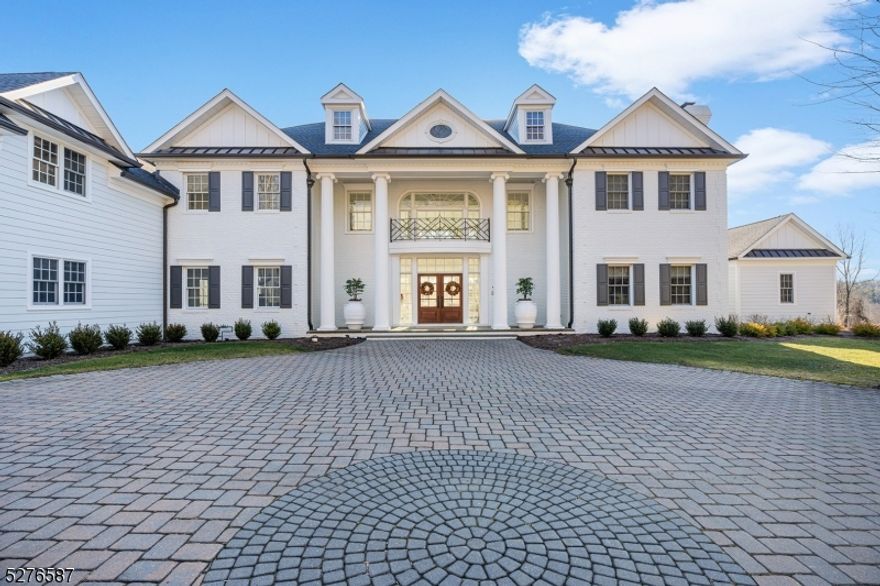 Twin Magnolia Manor is an unparalleled estate surrounded by 24+ farm-assessed acres in Mendham Township. Set beyond a gated, tree-lined drive, this professionally decorated six-bedroom, five-and-two-half bath home experienced a major renovation that blended on-trend design elements and timeless features. Warm weather entertaining is welcomed on two huge paver patios offering shaded and open areas, a massive outdoor brick fireplace, a heated pool complex with a jetted spa, custom stone surround, an outdoor kitchen, and a four-season pool house with a kitchen and full bath capped by a view-filled roof deck.