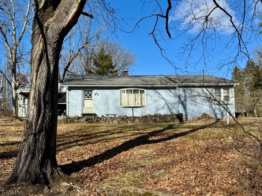 Bring your dreams of affordable homeownership and lots of elbow grease. This 3 bedroom ranch, set on just under an acre, is waiting for some TLC. Are you the right person who can see its potential? The combined living/dining room measures 28'x15" with oak floors, a gorgeous stone fireplace and plenty of natural light. The garage and attached utility room offer storage and room for hobbies. A formerly screened in/covered patio in back offers privacy and the opportunity to reinvent this interesting outdoor space. Newer roof, boiler and Roth oil tank. A generous yard and pretty views round out this home's appeal. Its perfect for starting out or downsizing...true one level living. Close to major highways for an easy commute. Near to hiking, fishing and all that country living has to offer.