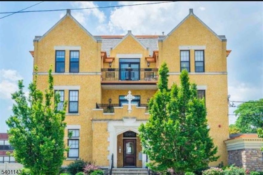 Sought After Spot in Bayonne! Beautiful move-in ready 2 Bed 1 Bath located in a unique professionally managed condo complex converted from a former convent featuring Spanish style architecture charm, garage parking, pet friendly and shared laundry. Unit features Central Air, hardwood flooring and carpeted bedrooms, high ceilings, updated kitchen with custom cabinetry, dining peninsula with granite countertops and a full bath with tub/shower combo. Modern living in historic surroundings with Low Monthly Fees. Access to private balcony off open floor plan. Modern commuter needs near Broadway local shops and restaurants, light rail, parks, waterfront recreation and NYC transportation.