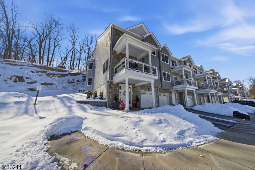 Welcome to this beautifully maintained 3-bedroom, 3.5-bath end-unit townhouse in the desirable Argonne Woods community in Butler. Hardwood floors span the main level, and abundant natural light fills the home from multiple exposures.The open-concept living and dining areas are perfect for everyday living and entertaining, featuring oversized windows, sliding glass doors to the deck, and seamless flow throughout. Upstairs offers three spacious bedrooms, including a primary suite with a private bath. The finished lower level adds flexible living space with a full bath ideal for guests, a home office, or recreation area. As an end unit, enjoy added privacy and extra light. Conveniently located near major highways, shopping, dining, and NJ Transit.Move-in ready and thoughtfully updated, this home offers easy, low-maintenance living in a fantastic setting.