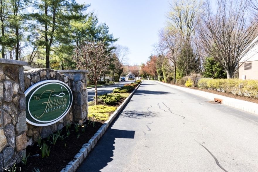 Wake up to sweeping GOLF COURSE VIEWS in this lovely 3-bedroom, 3.5-bath townhome in the prestigious Fairways at Livingston, a luxury gated community with only one residence currently available. This Riviera-style home blends warmth and comfort, featuring hardwood floors, ample built-in lighting, and a cozy fireplace. The sunlit main level offers a private office and an open kitchen with granite countertops, family room and dining area flowing effortlessly to a deck where tranquil green views become your everyday backdrop.Upstairs, the primary suite offers generous walk-in closet and a spa-like bath, while the finished lower level provides flexible space for relaxing, entertaining, or hosting guests.Enjoy a lifestyle of comfort and convenience with top-rated Livingston schools, resort-style amenities including pool, tennis, pickleball, basketball courts and a clubhouse with a gym and a party room. With easy access to NYC transportation, it's a rare opportunity to live beautifully. This home is not to be missed!