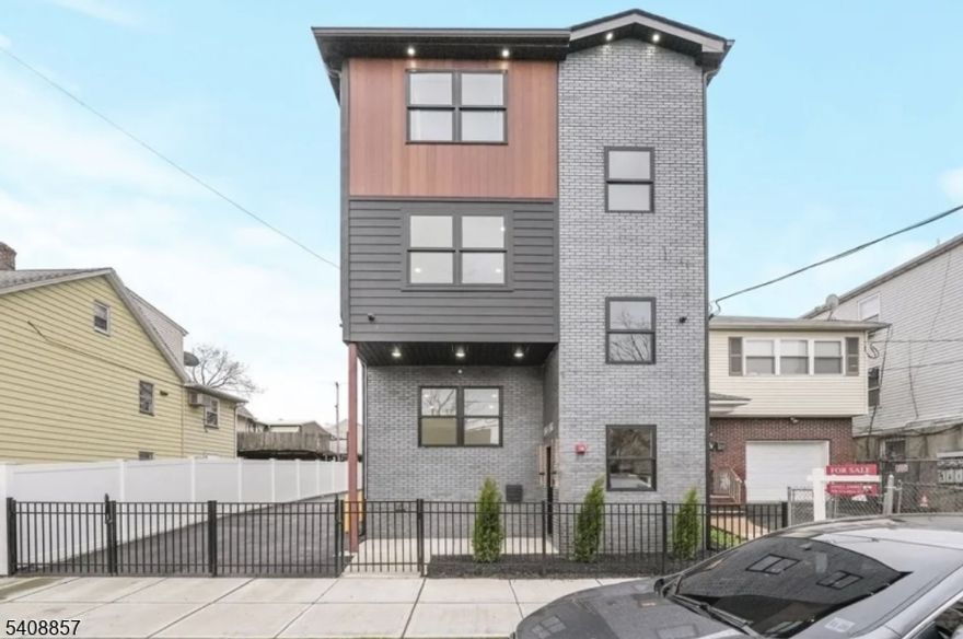 Modern Luxury Meets High-Yield Investing in ElizabethportElevate your portfolio with this stunning, nearly-new construction multifamily gem located in the heart of the rapidly developing Elizabethport section. Built in 2024, this property seamlessly blends contemporary design with the robust income potential or provides a sophisticated "live-for-free" opportunity for the savvy owner-occupant. Each unit is a masterclass in modern urban living, featuring Spacious Layouts Multiple units featuring 3 generous bedrooms and 2 designer bathrooms. Sleek cabinetry, quartz countertops, and high-end stainless steel appliances. Gleaming hardwood flooring, high ceilings, and expansive windows that flood the space with natural light.   In-unit laundry hookups, central HVAC, and energy-efficient LED lighting throughout. Parking & Storage: Includes a rare detached garage and additional driveway parking.  Low Maintenance benefit from the "new construction" peace of mind with updated systems, roofing, and structural integrity. Minutes from the Elizabeth Train Station (NJ Transit) and North Elizabeth Station for a direct shot into NYC. Less than 15 minutes to EWR. "Walk Score" (84) puts you steps away from local dining, parks, and schools, with easy access to the Jersey Gardens Mall.  This property represents an asset in a submarket seeing double-digit value appreciation over the last few years.