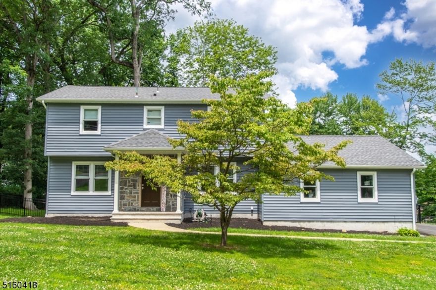 Renovated top to bottom just ONE YEAR ago (2021). This Spectacular & Beautifully Appointed 4 BDRM Center Hall Colonial is nestled in desirable Beacon Hill. Picture Perfect Neighborhood & Tree Lined Streets w/curbs. Flowing, classic layout great for entertaining. Formal living room. Modern kitchen w/granite counters, polished ceramic tile backsplash, center island, ultra white cabinets, SS appliances & natural gas cooking which opens to the sun-filled FR. Sliders walk out to the trex deck & large, level fenced in yard. Convenient powder room. Gorgeous dark HW flooring throughout. Neutral grays throughout. New windows & blinds! High hat lighting. Upstairs 4 large bedrooms including a master which boasts 2 closets & a stunning en-suite w stall shower. BSMT w/high ceilings- bonus living w/potential to finish & tons storage. Large 2 car garage provides even more storage. All new mechanicals. Situated in a great location with easy access to all life's conveniences- Walking distance from NYC-Direct train station, shopping, parks. Enjoy bustling Dwtn Denville or choose to visit historic Mt Tabor w/all its colorful homes, post office, library & LIVE Tabernacle events. EZ access to major hwys, mass transit & top-rated schools.