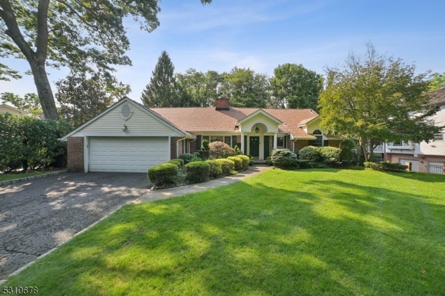 This stunning 4 bedroom, 4.1 bath Ranch has incredible natural light, a great floor plan, and terrific amenities including a Generac generator, solar panels, newer roof, multi-zone heat/AC, alarm system & underground sprinklers, ideally located on a quiet street walking distance to highly rated Deerfield Elementary School. The living room features chair rail & custom built-ins & the dining room has a wood-burning FP, recessed lights & a pair of French doors that open to a huge maintenance free deck & beautiful property. The gourmet eat-in kitchen has a pair of sliders to the deck and is totally open to the family room w/ wood-burning FP, vaulted 16' ceiling w/ ceiling fan & 2 skylights. Easy access to attached garage. The primary suite includes a 16' vaulted ceiling w/ ceiling fan, recessed lights, new wall to wall carpet, 2 WICs, Palladian windows & spa-like primary bath w/ jacuzzi, shower & double sinks. 2 more bedrooms & 2 full baths complete the 1st level. Lower level features a 4th bedroom & full bath perfect for in-law or nanny suite, an office, exercise room, laundry room, & wet bar flowing into a large room that could be used for a play room or media room. This incredible Short Hills ranch is ideally situated on 0.45 acres of level property facing the South Mountain Reservation. Walk right out your front door & into the 2,000+ acres of woodlands & hiking trails from a trailhead across the street. Don't miss this gem in one of Short Hills' most desirable neighborhoods.