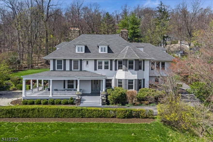 Perched high above Montclair with sweeping, unobstructed views of the New York City skyline, this stunning 8 bedroom,4 full and 3 half bath residence offers a rare blend of timeless charm and modern design. Meticulously maintained, the home honors the elegance of a bygone era while seamlessly embracing today's lifestyle. At its heart is an architect-designed modern kitchen, thoughtfully curated with premium finishes and clean lines, flowing effortlessly into a striking floor-to-ceiling glass familyrm addition. Flooded with natural light from floor-to-ceiling windows, this dramatic space creates an unparalleled setting for both everyday living and entertaining. The primary ensuite is a true retreat, featuring a spa-like bath, spacious walk-in closet, and a private home office overlooking the breathtaking Manhattan skyline. Generous living and dining spaces, rich in character and detail, complement the home's contemporary updates. Eight spacious bedrooms provide flexibility for guests, play and home office needs. Bonus carriage house features a one bedroom apartment above the two car garage. The private setting offers a true sense of retreat, all while being moments from Montclair's vibrant downtown known for its trendy restaurant scene, boutique shopping, beautiful parks and just a few blocks to the NYC train for a seamless commute. A one-of-a-kind offering where classic architecture and modern luxury meet set against a backdrop that simply cannot be replicated.
